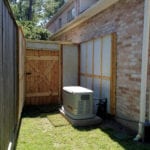 A white generator in a garden