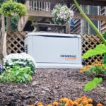 A white generator in a garden