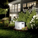 A white generator in a garden