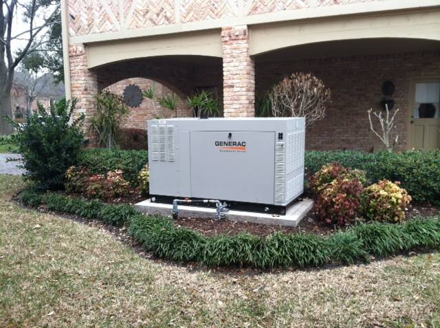 A large generac brand generator outside a home in a garden