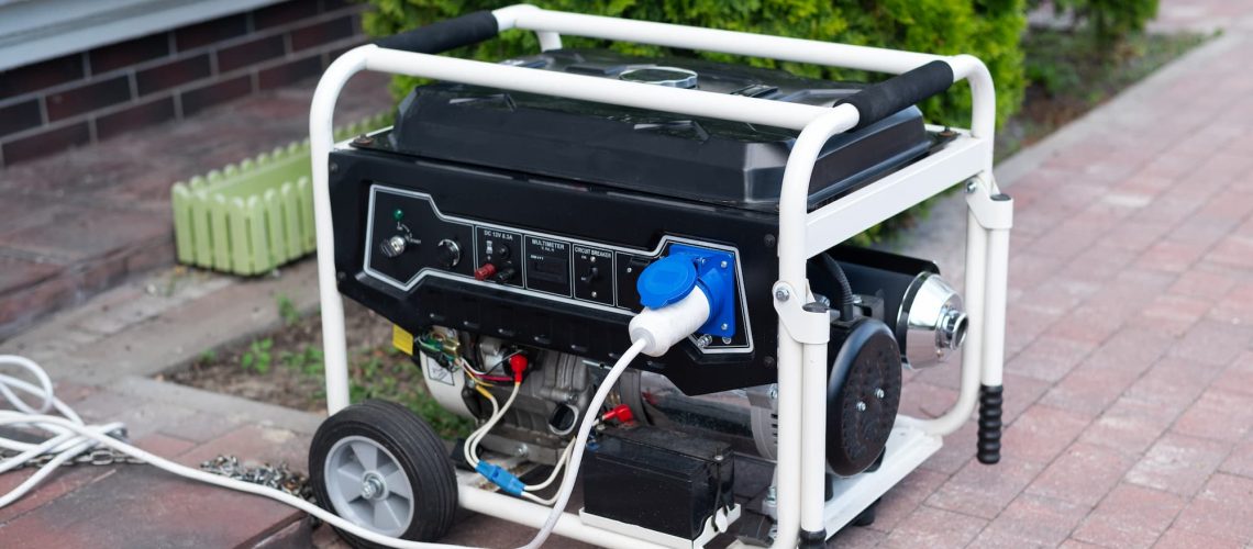 a photo of a small generator on wheels set up outside